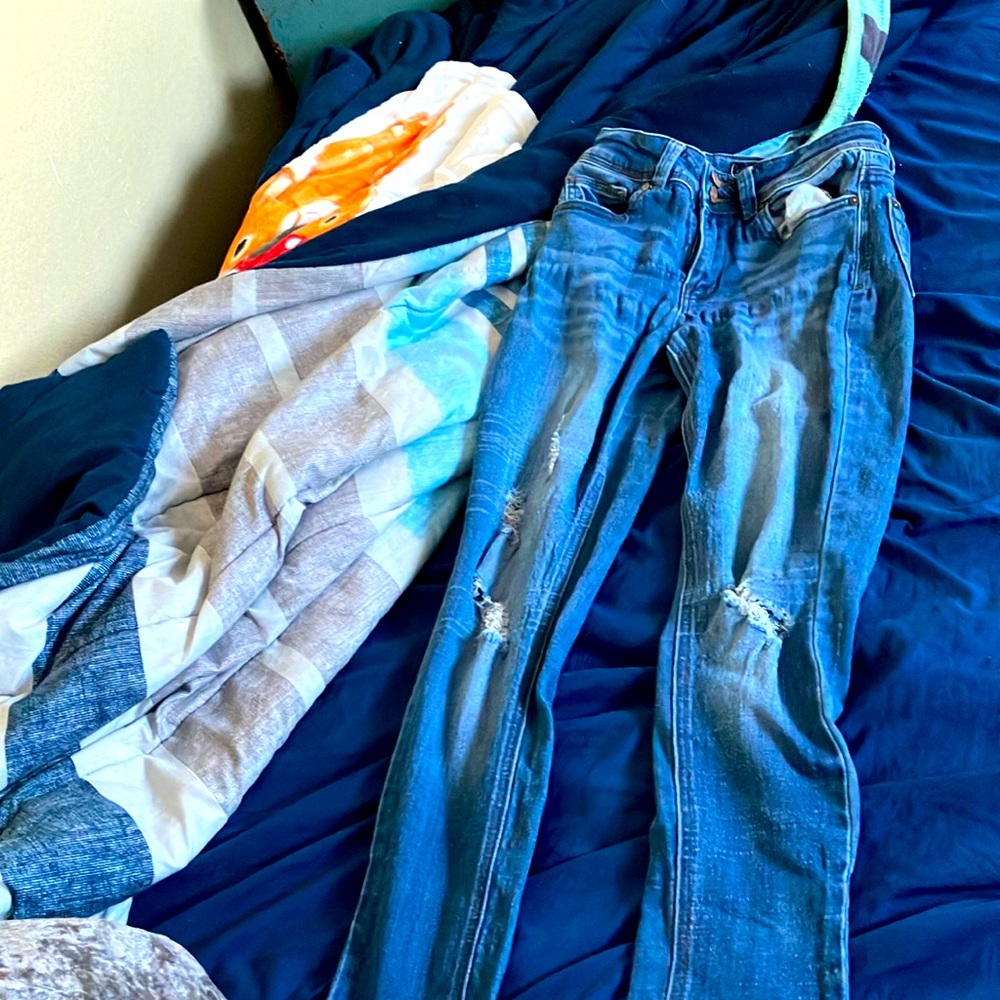Various different branded jeans.